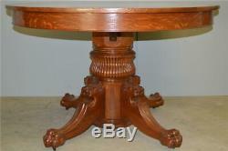 17111 Tiger Oak 48 Round Lion Head Dining Table