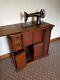 1900's Antique Singer Sewing Machine In Tiger Oak Closed Cabinet With Treadle