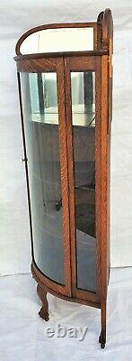 American Tiger Oak Bowed Bent Glass China Corner Cabinet with Claw Feet 1900s