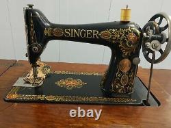 Antique 1917 Singer Treadle Red Eye Model 66 Sewing Machine on tiger oak cabinet