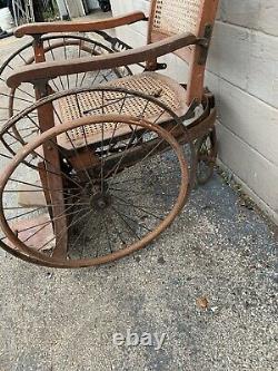 Antique Arrow Wheel Chair Tiger oak and wicker ww1 rare find 1800s (not Sure)