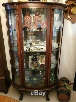 Antique Darker Tiger Oak Lion Head Claw Foot Curved Glass China Curio Cabinet