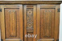 Antique English Tiger Oak Carved Double Door Wardrobe With Linen Fold Accents