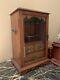 Antique English Tiger Oak Pipe Cabinet With Glass Doors