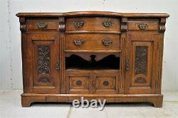 Antique English Tiger Oak Relief Carved Buffet or Sideboard With Radial Front
