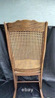 Antique Lincoln Tiger Oak Arm Rests Cane Rocking Chair with Sturdy Seat 1875
