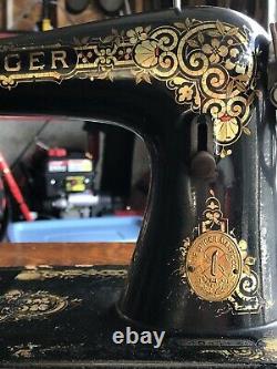 Antique Singer Treadle Sewing Machine In A Tiger Oak Closed Cabinet