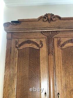 Antique Tiger Oak Armoire Carved with beautiful grain and detailing