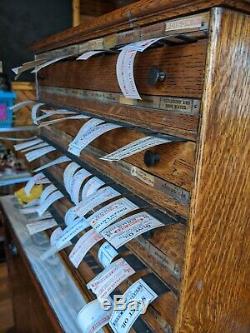 Antique apothecary pharmacist bottle labels dispenser Tiger oak cabinet Poison