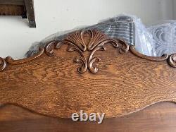 Antique carved oak bed with tiger oak trim