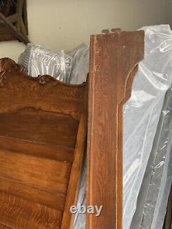 Antique carved oak bed with tiger oak trim