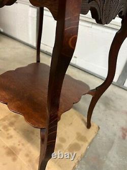 Antique quarter sawn tiger oak parlor table, cloverleaf design