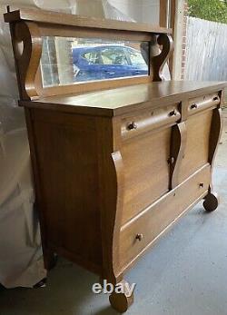 Antique tiger oak Empire sideboard buffet with beveled glass mirror