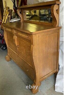 Antique tiger oak Empire sideboard buffet with beveled glass mirror