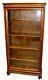 Early 20th C. Tiger Oak Single Door Bookcase With Original Glass & Casters