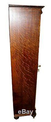 Early 20th c. Tiger Oak Single Door Bookcase With original Glass & Casters