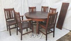 Stickley Round Oak Mission Arts & Crafts Dining Table, 1 Leaf, & 6 Chairs 1910's