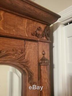 Tiger Oak Armoire 2 door with Fancy beveled Glass beautifully carved