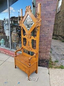 Victorian Antique Seated tiger oak mirrored Hall tree with north wind face hooks