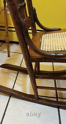 Victorian Era Pressed Back Tiger Oak Rocking Chair With Spindles & Cane Seat